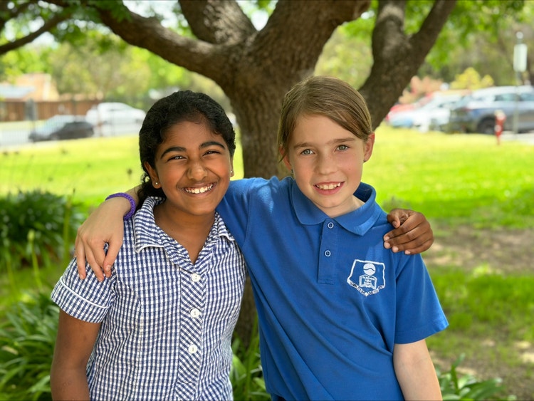 Two students posing in the playground