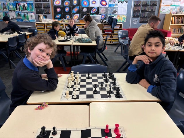 Students playing chess in the classroom