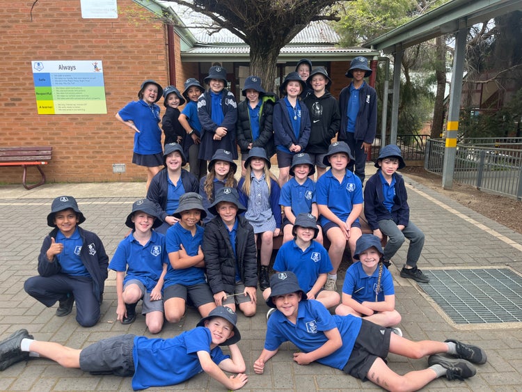 Students posing for a photo in school playground